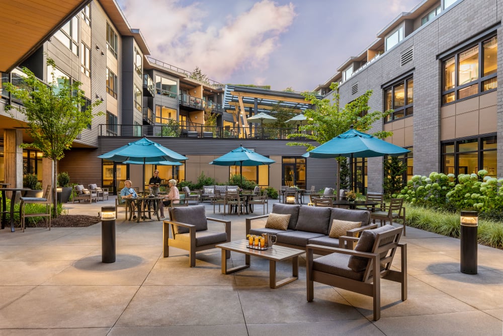 Secluded community patio with lots of seating and flora at The Springs at Lake Oswego in Lake Oswego, Oregon