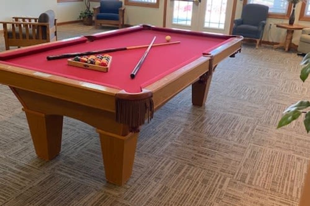 Resident game room with pool table at Prairie Hills Tipton in Tipton, Iowa.