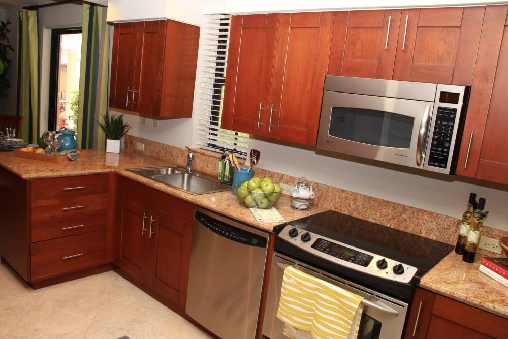 Kitchen with stainless steel appliances at The Heritage at Boca Raton in Boca Raton, Florida