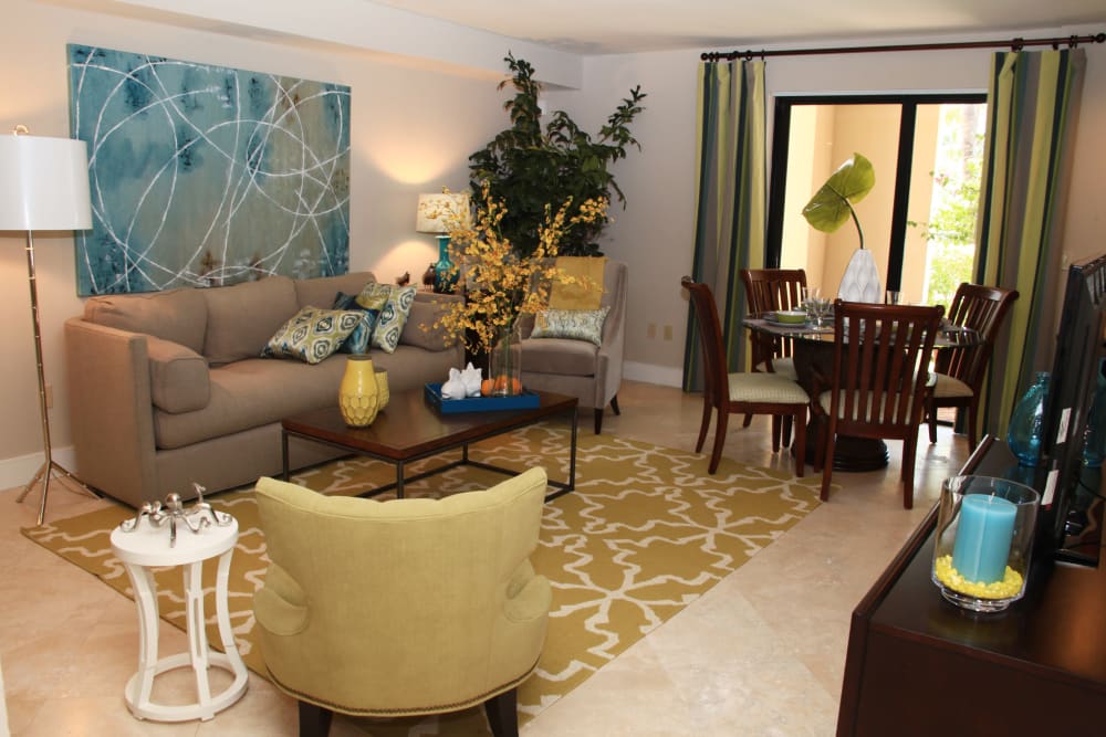 Living room with private patio access at The Heritage at Boca Raton in Boca Raton, Florida
