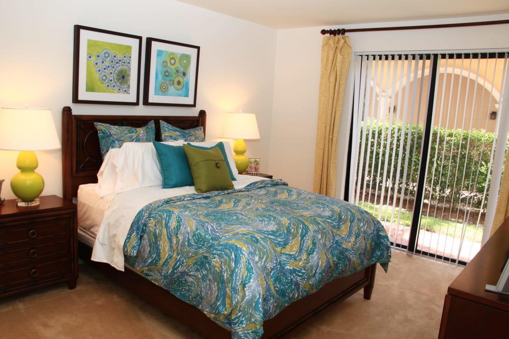 Bedroom with private patio access at The Heritage at Boca Raton in Boca Raton, Florida