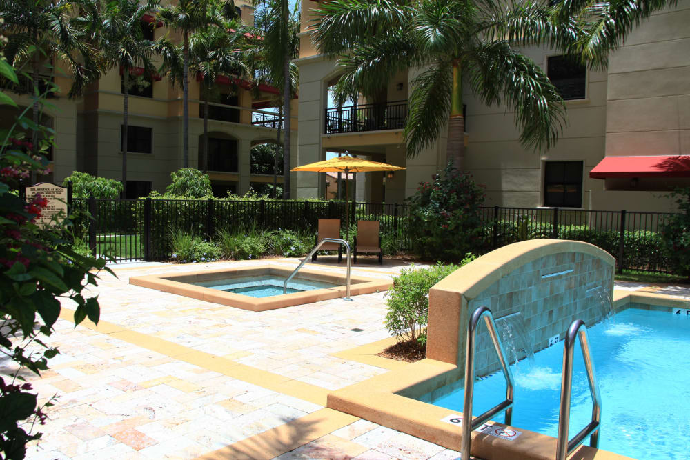 Outdoor pool and hot tub at The Heritage at Boca Raton in Boca Raton, Florida