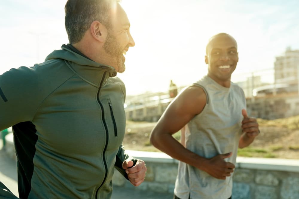 Friends out on an evening run on a gorgeous day near Vidorra McKinney Avenue in Dallas, Texas