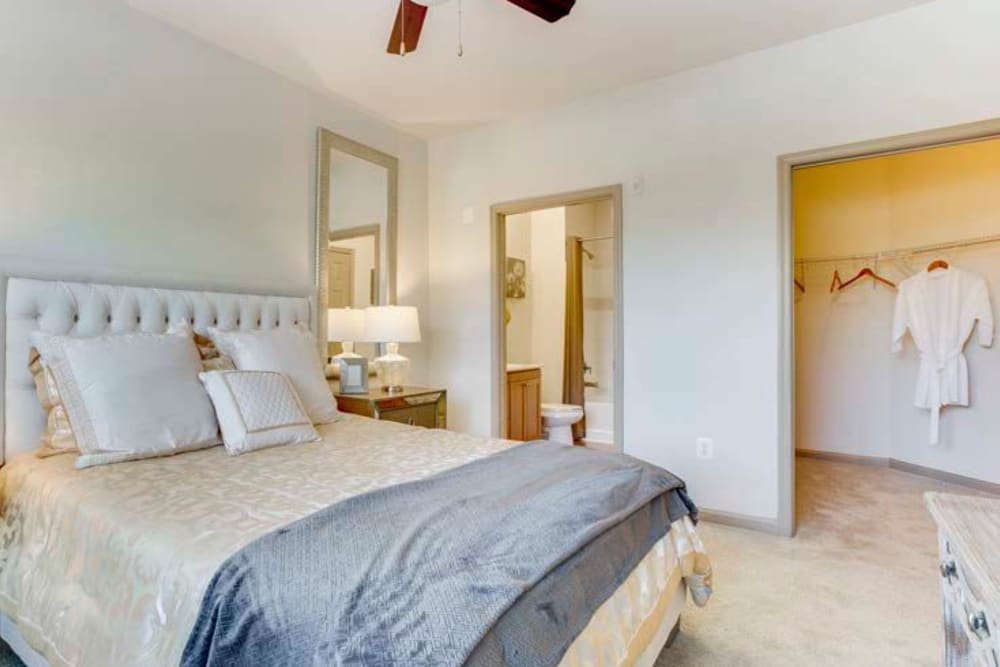 Model bedroom with ceiling fan and lots of closet space at Summerfield at Morgan Metro in Landover, Maryland
