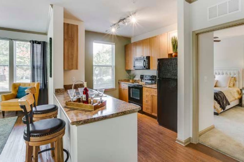 Decorated kitchen with breakfast bar and tons of counter space at Summerfield at Morgan Metro in Landover, Maryland