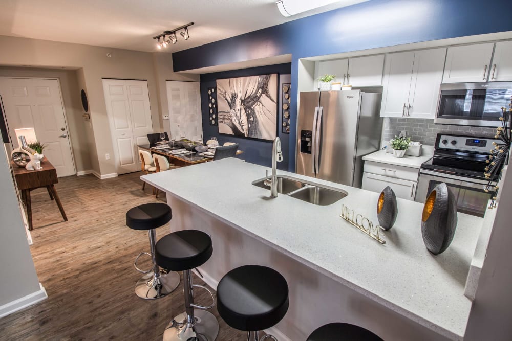 Kitchen dining area with large island and breakfast bar for tons of counter space at The Pearl in Ft Lauderdale, Florida
