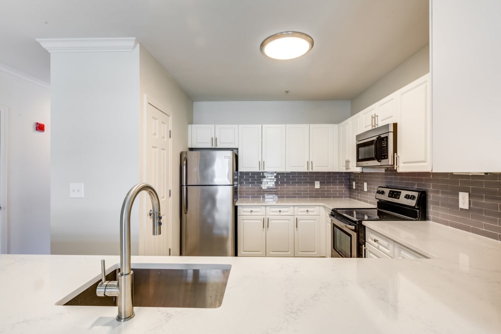 Kitchen with modern appliances at Sofi at Salem Station in Salem, MA