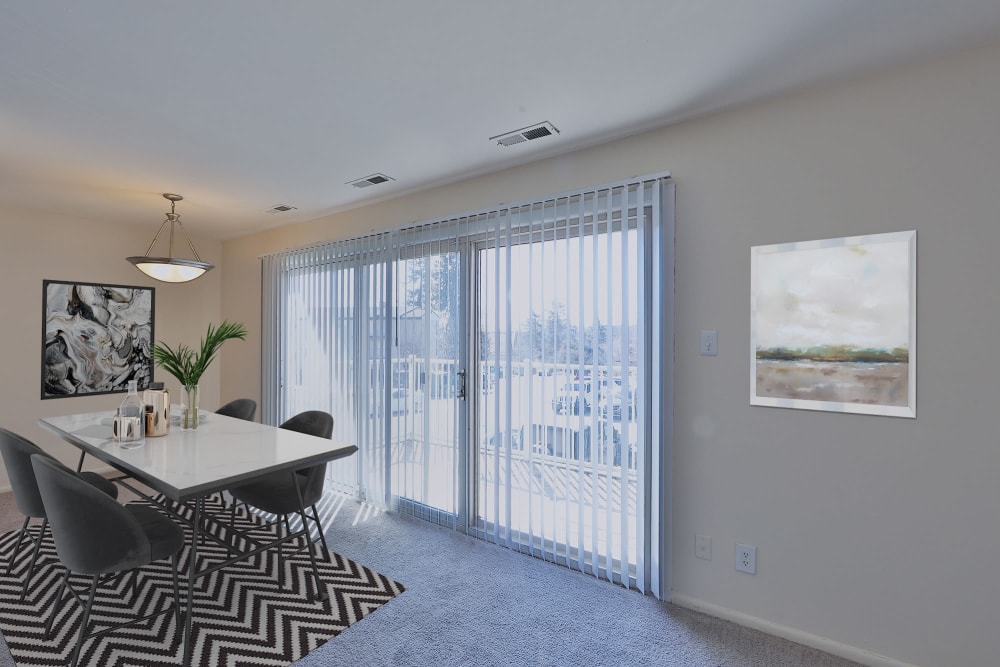 Dining room with slider at Morningside Apartments & Townhomes in Owings Mills, Maryland