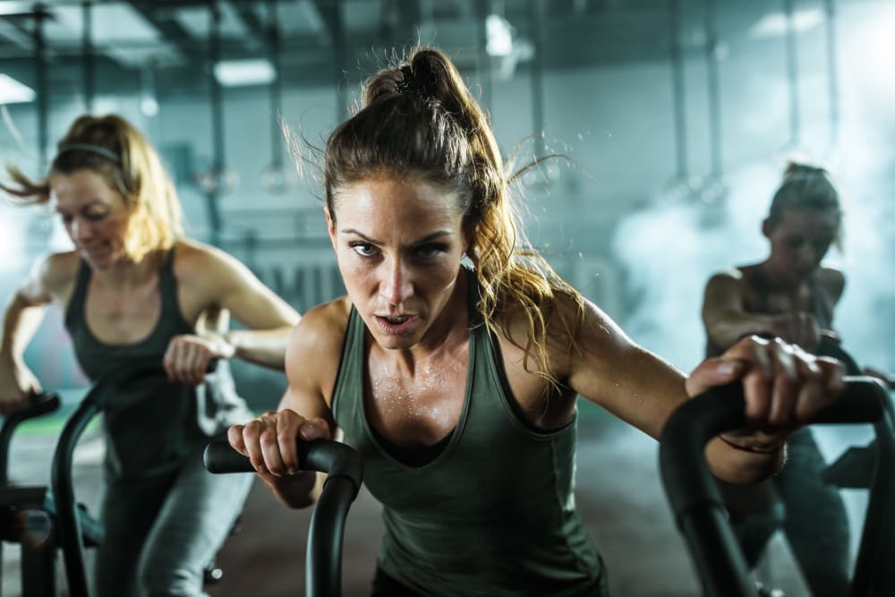 Three women working out at The Planet in Toronto, Ontario