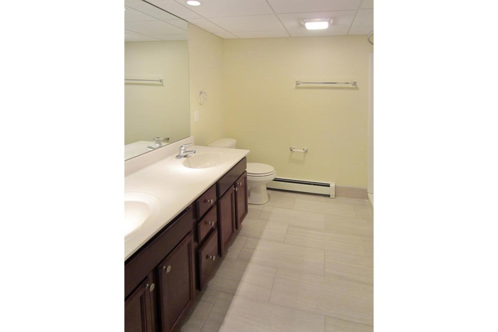 Clean bathroom with tons of counterspace and tile style flooring at Eagle Rock Apartments at West Hartford in West Hartford, Connecticut