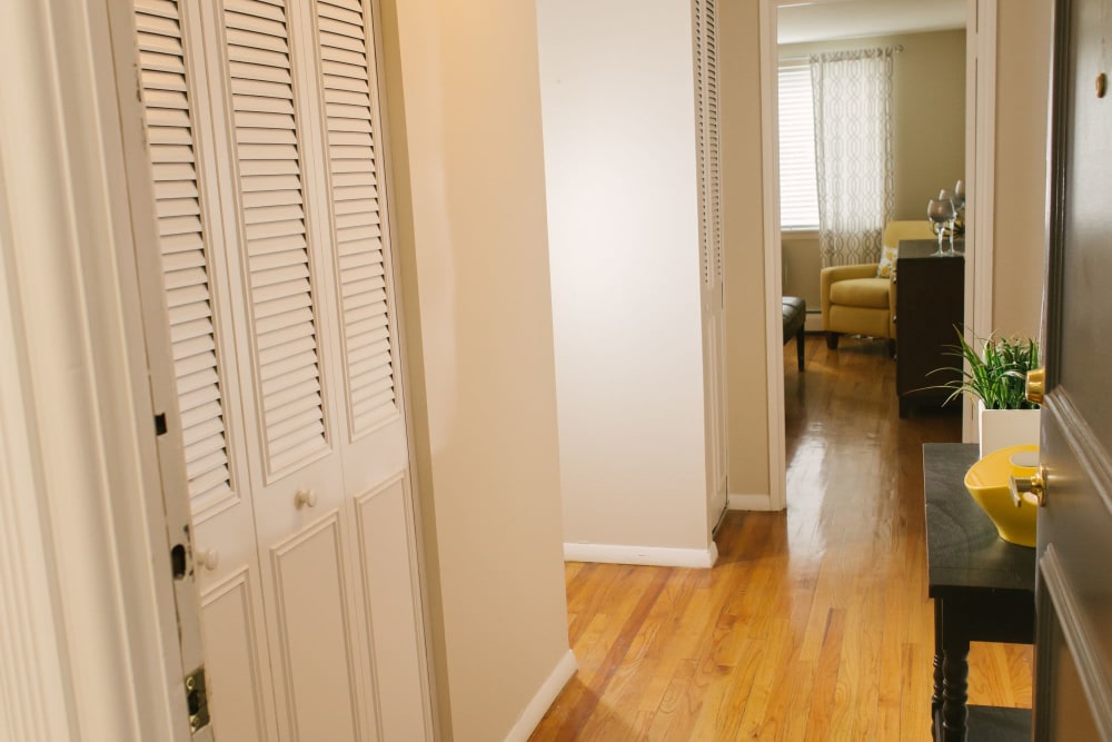 Small walkway in home with cute decor on the wood style flooring at Eagle Rock Apartments at West Hartford in West Hartford, Connecticut