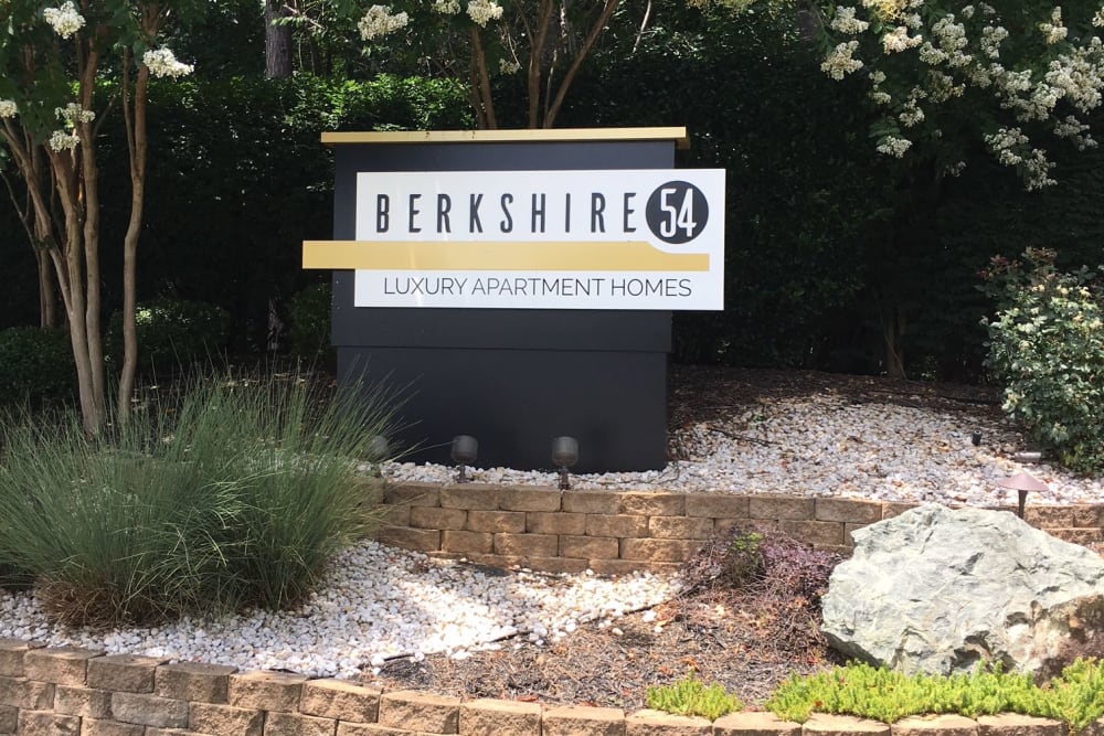 Entrance sign with a cool landscape surrounding at Berkshire 54 in Carrboro, North Carolina