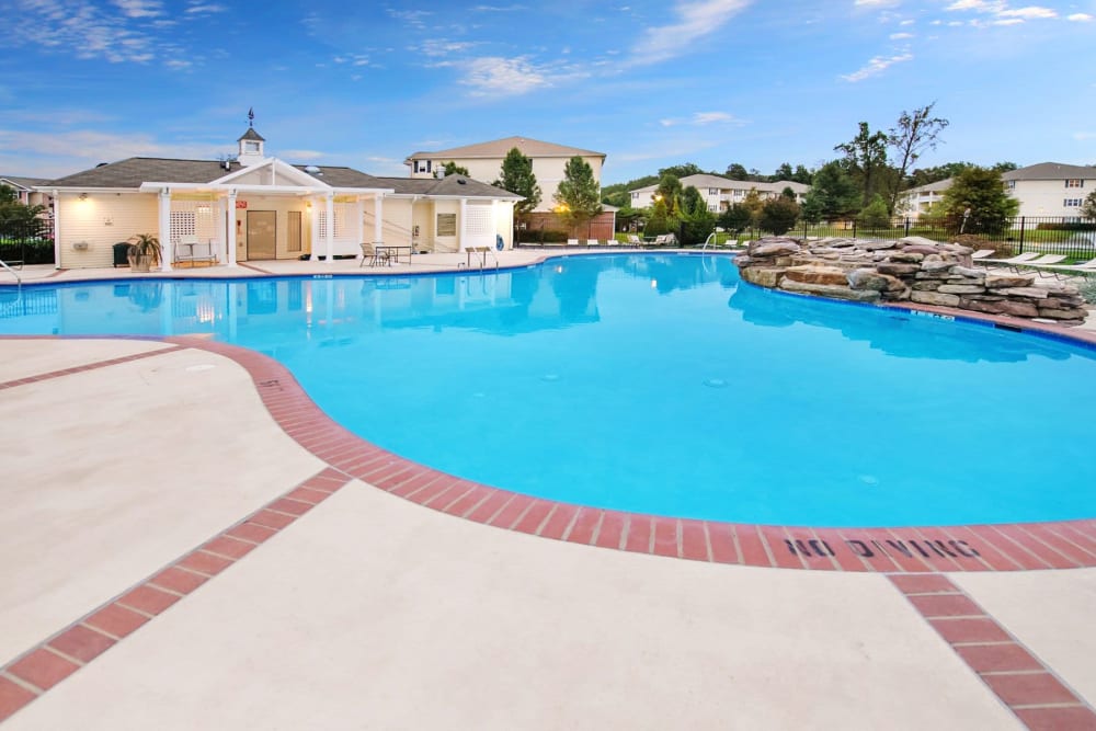 Resort style swimming pool on a gorgeous day at Mill Pond Village Apartments in Salisbury, Maryland