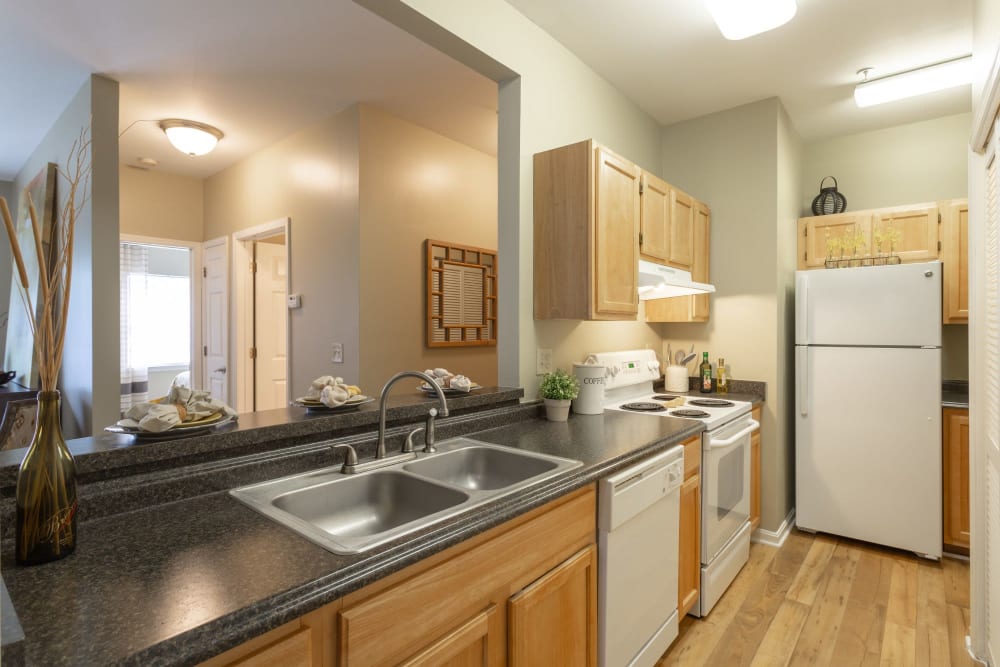 Spacious open-concept kitchen floor plan in a model home at Mill Pond Village Apartments in Salisbury, Maryland