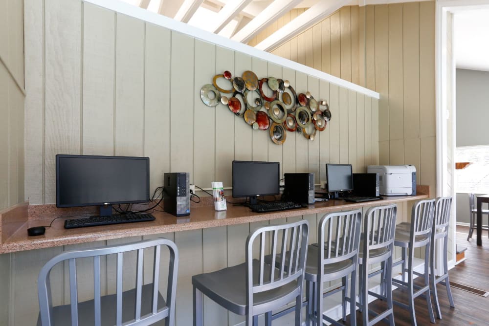 Community computer and office area for residents to work out of at The Flats at Arrowood in Charlotte, North Carolina