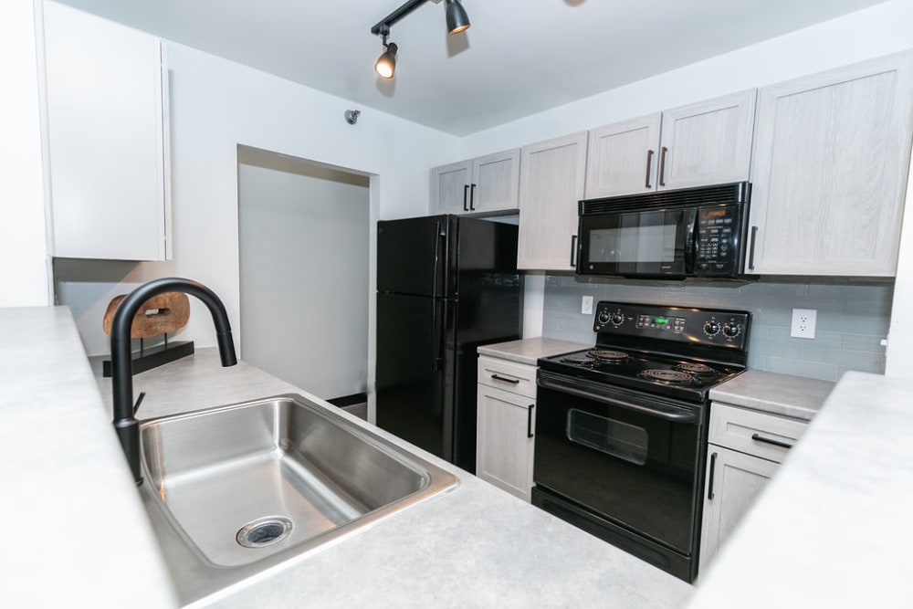 Kitchen with stainless steel appliances at Lofts at Riverwalk in Columbus, Georgia