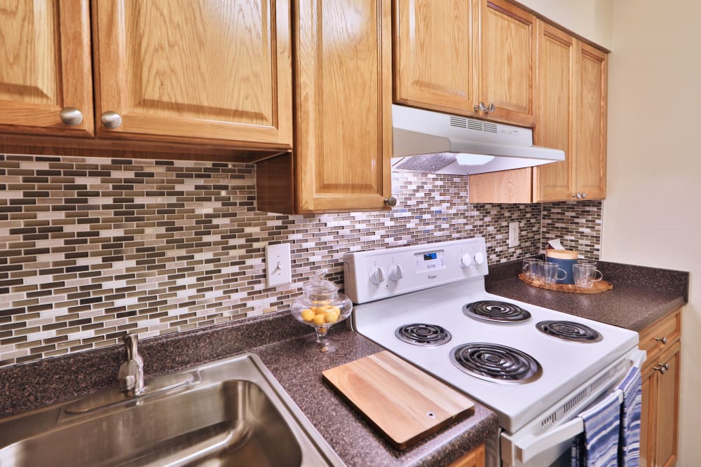 Kitchen with white appliance at The Willows Apartment Homes in Glen Burnie, Maryland