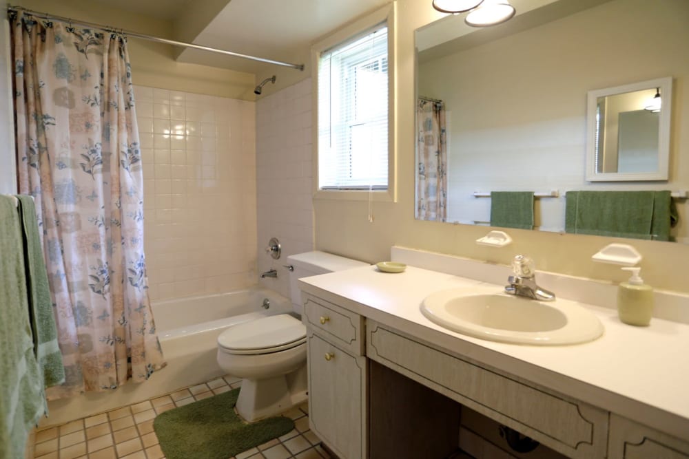 Bathroom with a large mirror and tons of counter space at Glenwood Apartments in Old Bridge, New Jersey