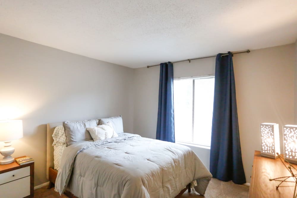 Large bedroom with tons of light at The Flats at Arrowood in Charlotte, North Carolina