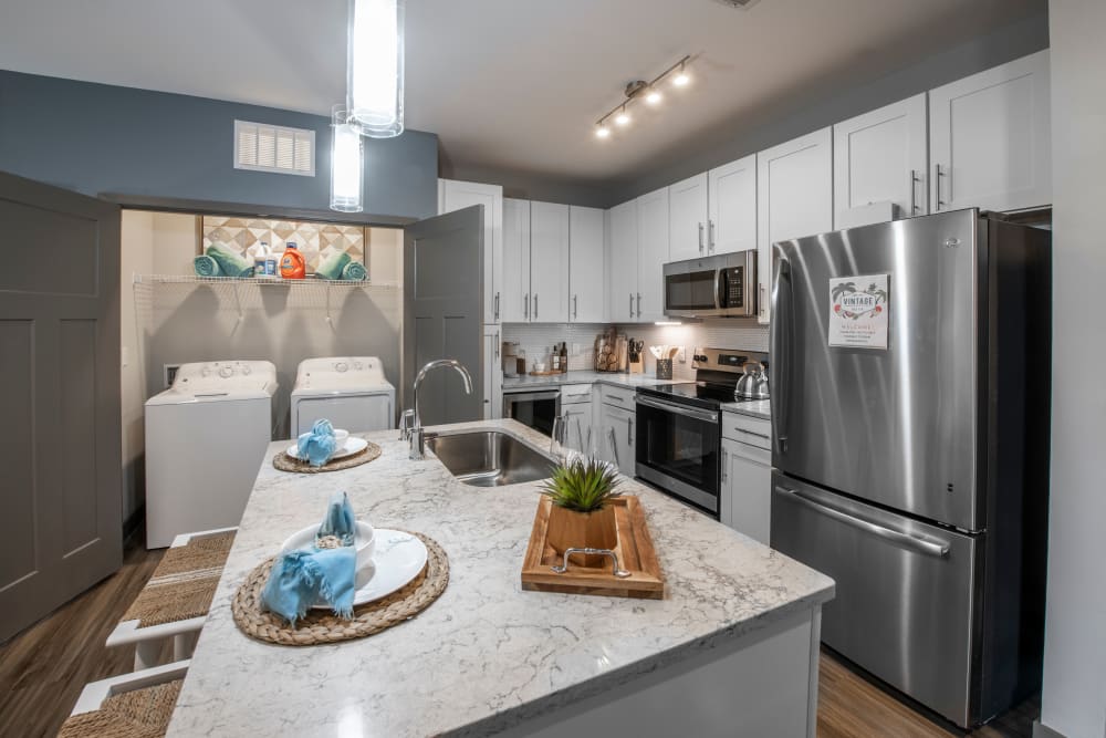 A spacious kitchen with stainless-steel appliances at Olympus Emerald Coast in Destin, Florida