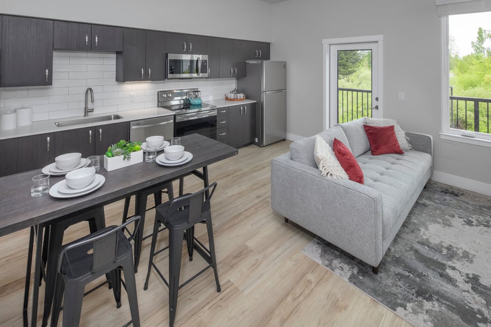 Model living room and kitchen at Brookside Apartments in Gresham, OR