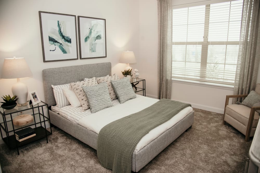 Bright carpeted bedroom at The 450 in Lombard, Illinois