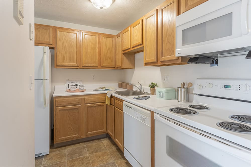 Fully equipped kitchen at Webster Manor Apartments in Webster, New York