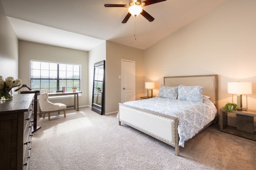 Modern-style, spacious bedroom at Marquis at Treetops in Austin, Texas