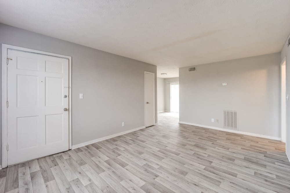 Hardwood-style flooring in the living area of an apartment at Sedgefield in Marietta, Georgia