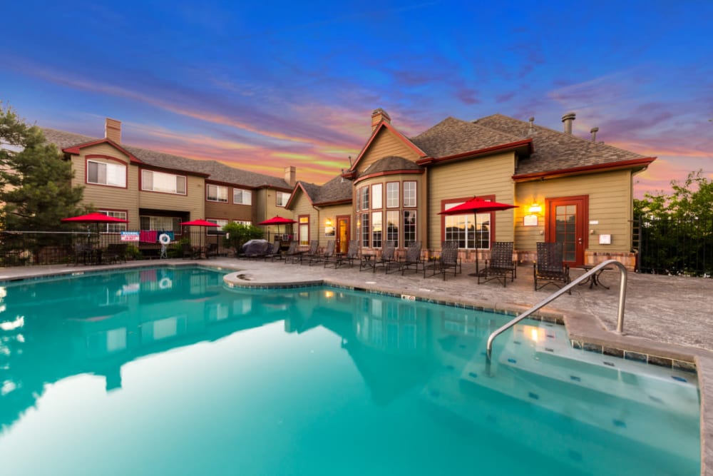 Resort-style heated swimming pool with spa and golf course views at The Links at Plum Creek in Castle Rock, Colorado