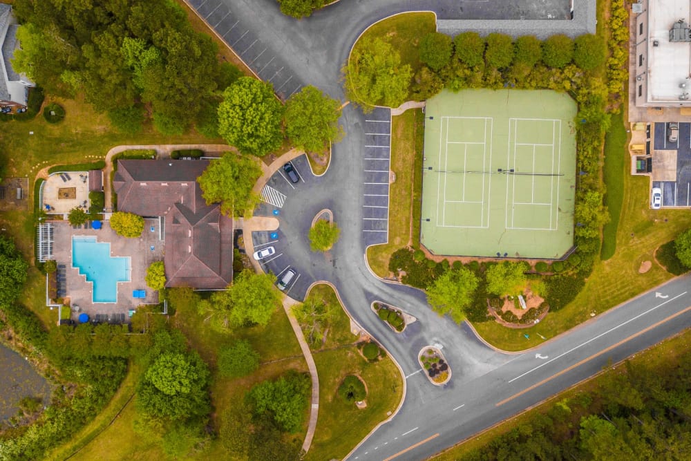 Aerial View of the Swimming Pool & Tennis Courts at Manchester at Wesleyan Apartment Homes in Macon, Georgia