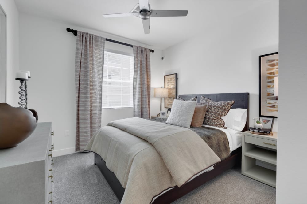 Primary bedroom with an en suite bathroom in a model home at Olympus Alameda in Albuquerque, New Mexico