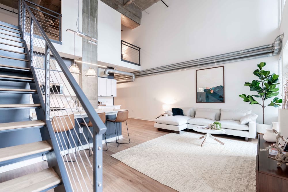 Open living room with modern decor and furniture at 17th Street Lofts in Atlanta, Georgia