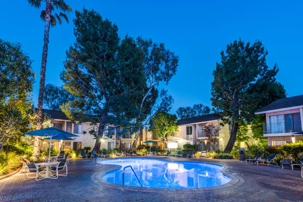 Dusk at the swimming pool with underwater lights on at Village Pointe in Northridge, California