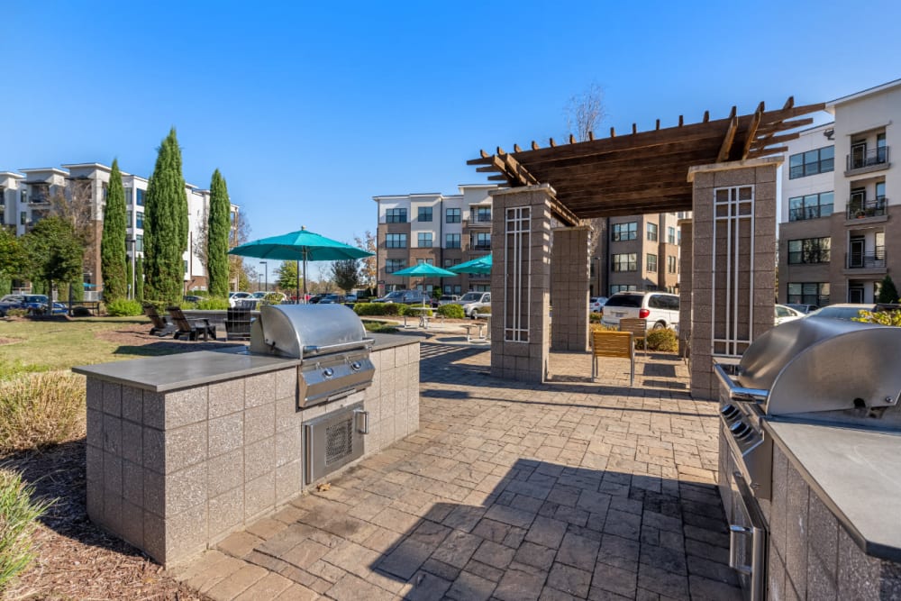 Stainless steel BBQs with nearby gazebo at Marq at Crabtree in Raleigh, North Carolina