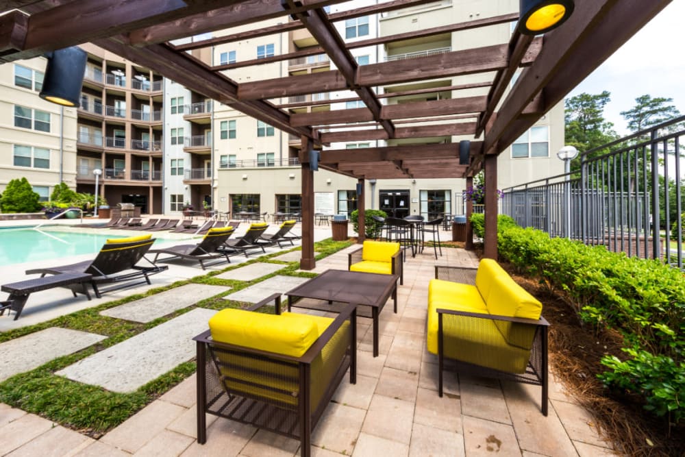Partially shaded seating area on pool deck at Marq Eight in Atlanta, Georgia