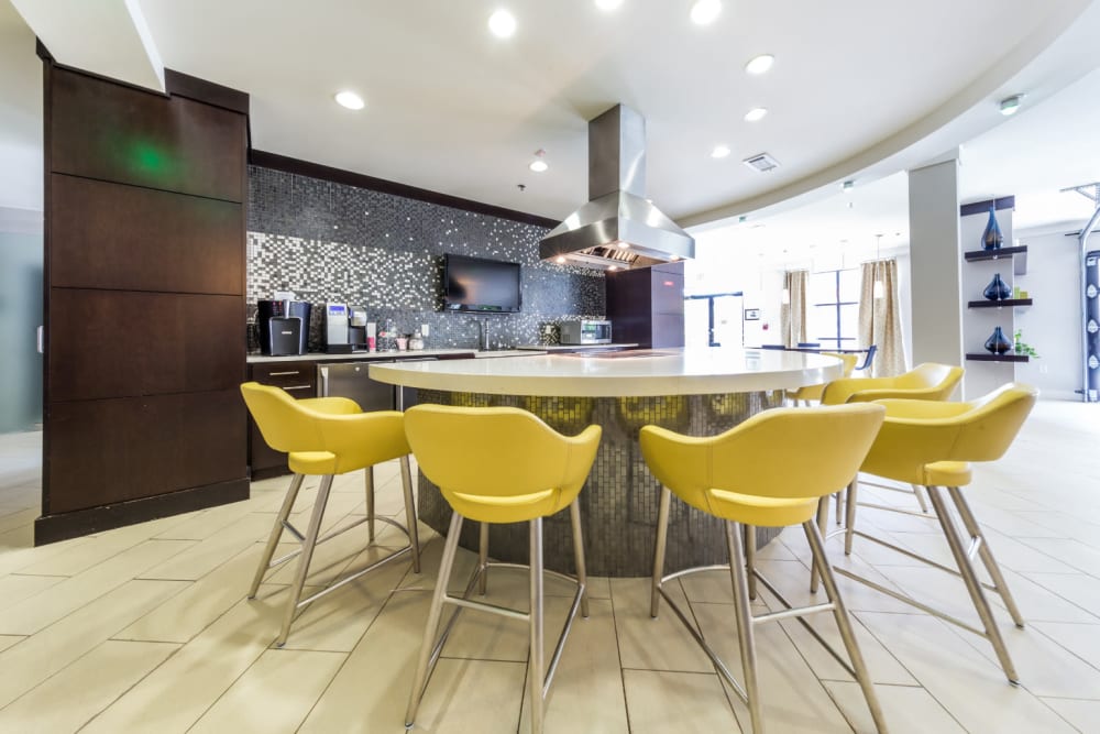 Community clubhouse dining counter with built-in electric stovetop at Marq Eight in Atlanta, Georgia