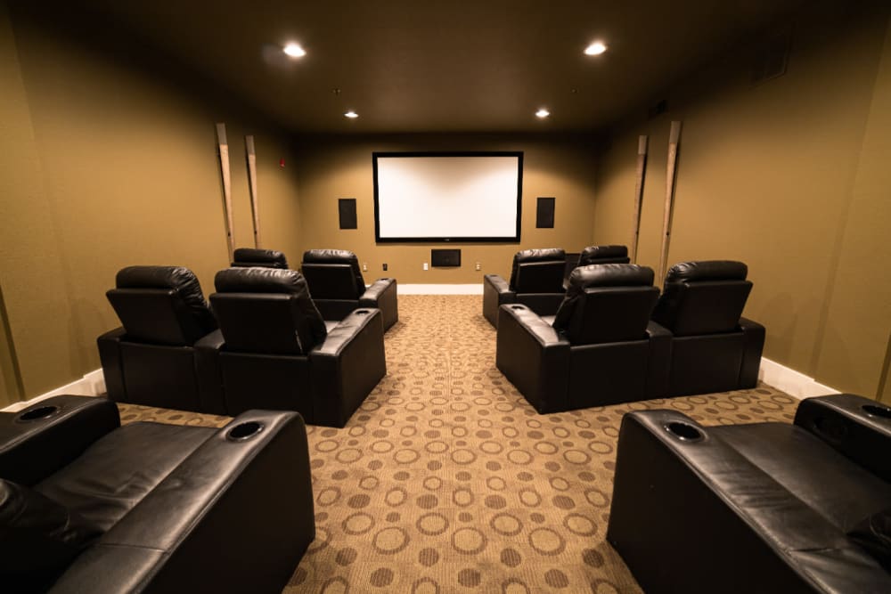 Private community theater with leather seats at Marquis at Texas Street in Dallas, Texas