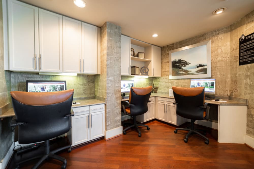 Executive business center with workstations at Marquis at Texas Street in Dallas, Texas