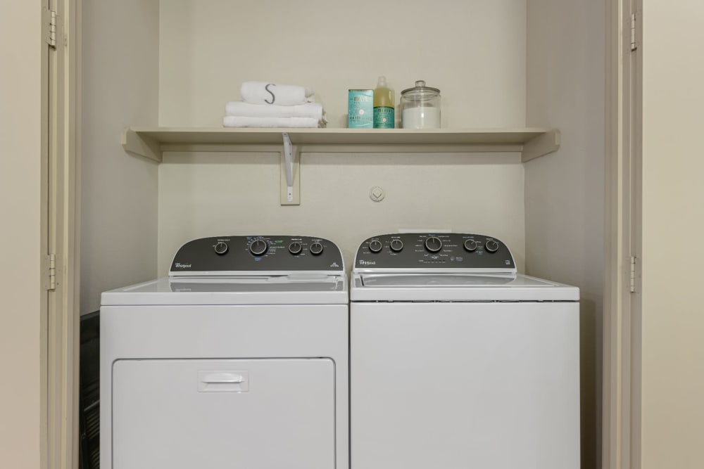 Laundry closet with full size washer and dryer at Sabina in Austin, Texas
