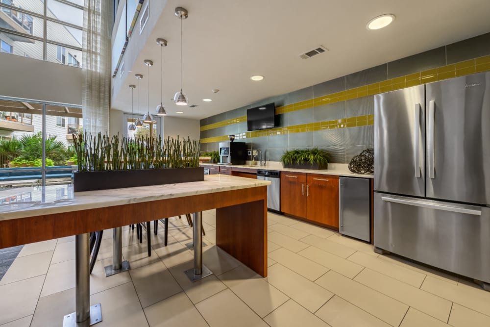 Large community clubhouse kitchen with stainless steel appliances at Sabina in Austin, Texas