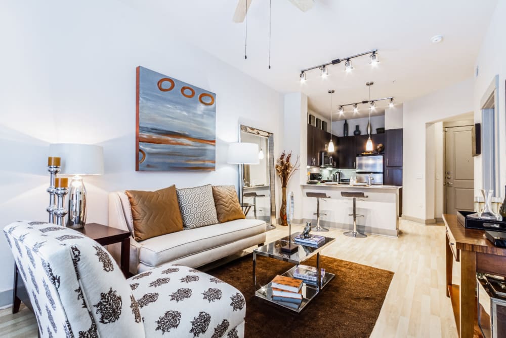 Open living floor plan with modern furniture and décor at The Marq on Voss in Houston, Texas