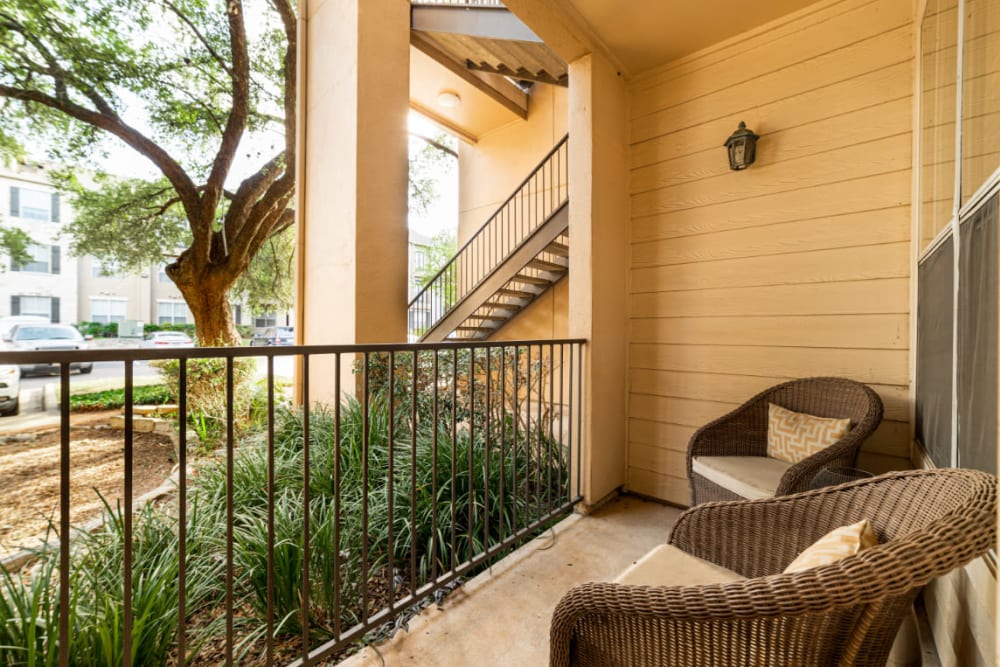 Private balcony with outdoor seating furniture at Marquis at Great Hills in Austin, Texas