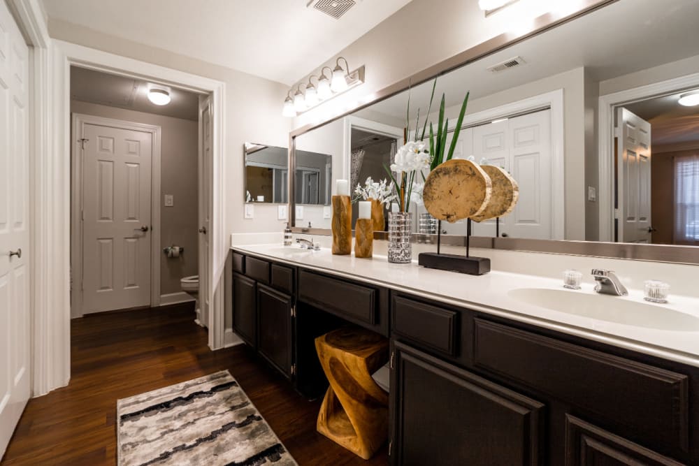 Large bathroom with double sinks with separate shower and toilet area at Marquis at Great Hills in Austin, Texas