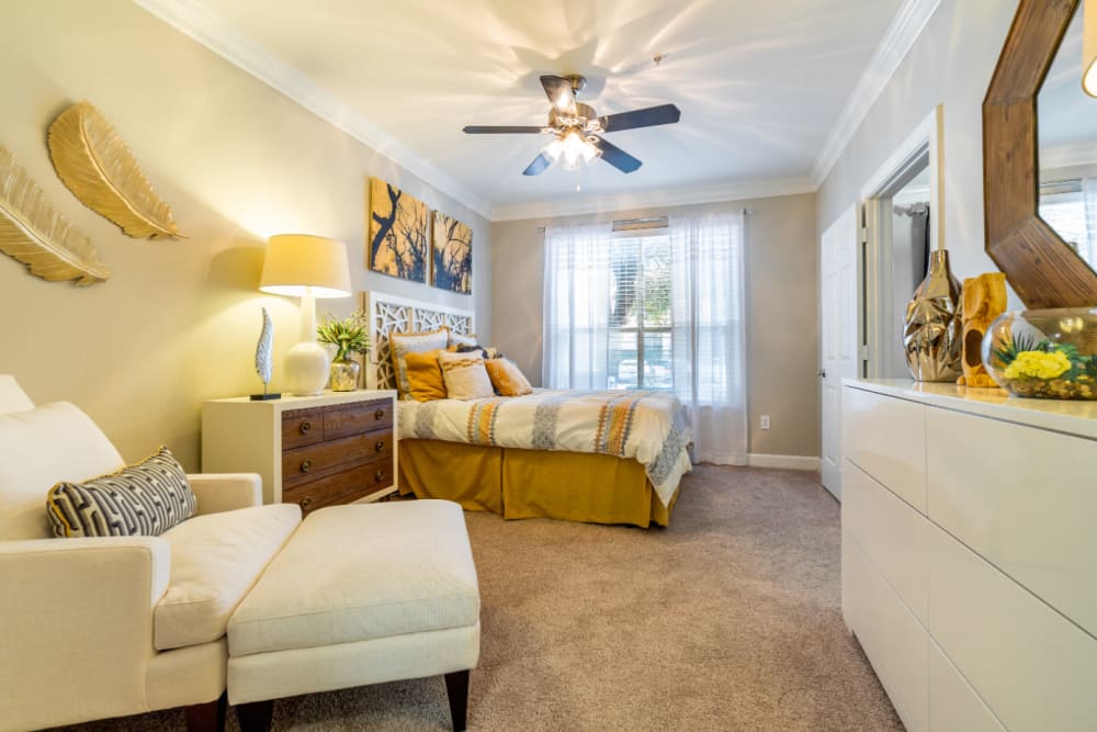 Large, spacious bedroom with sitting area at Marquis at Great Hills in Austin, Texas