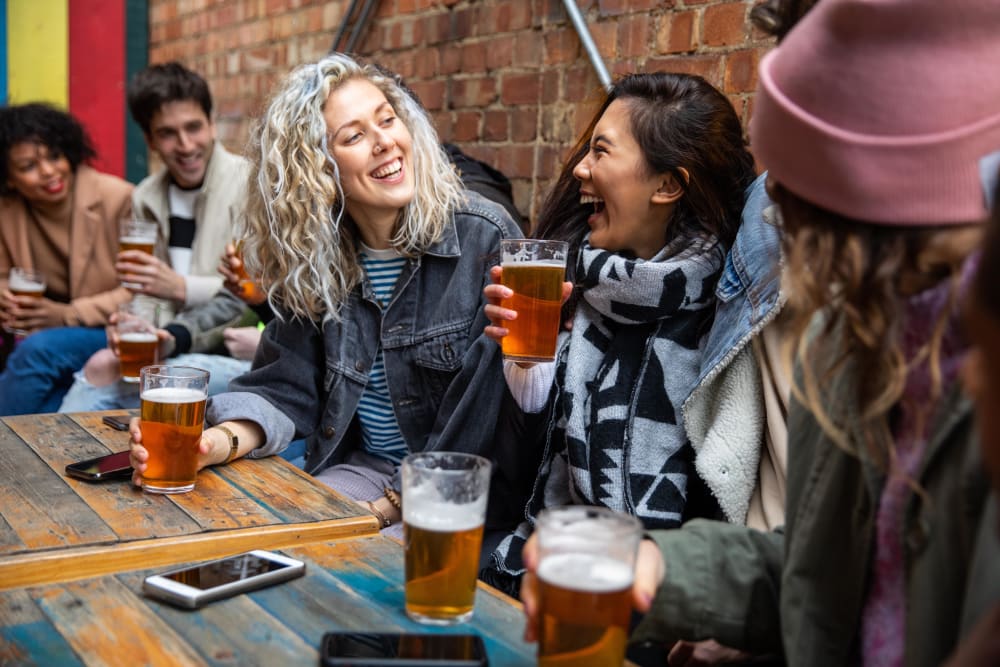 Residents chatting over drinks and food near Marvel 29 in Portland, Oregon