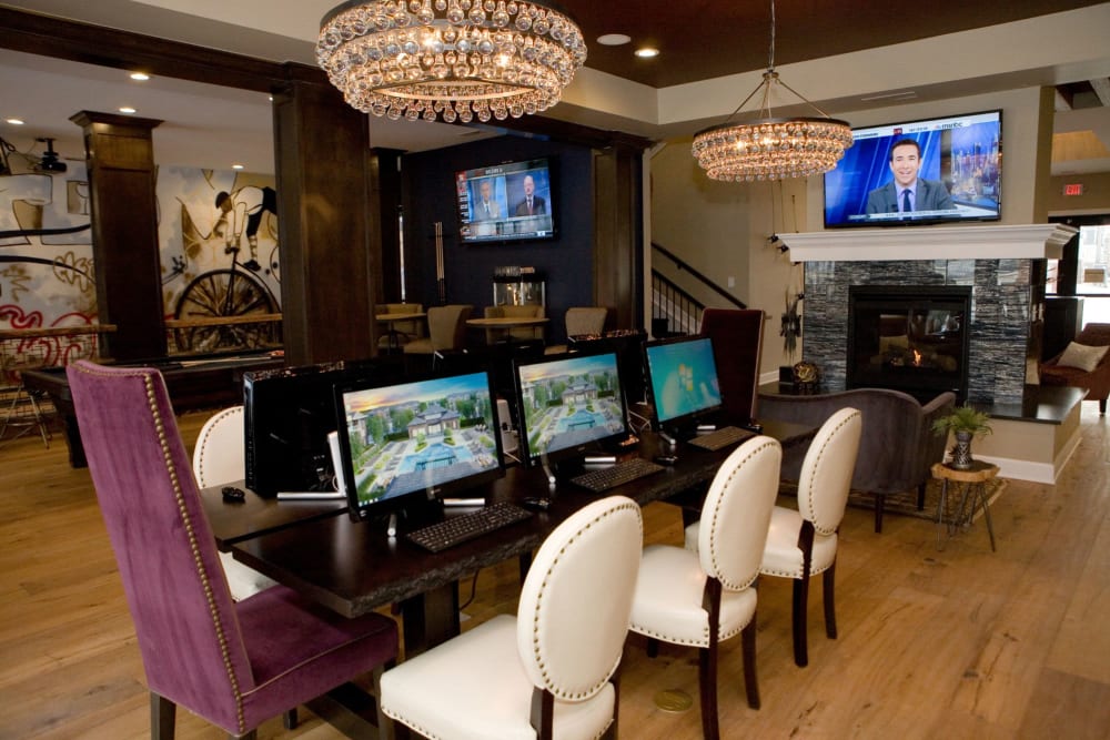 Business center fully-equipped with computers and a tv at Clifton Park Apartment Homes in New Albany, Ohio