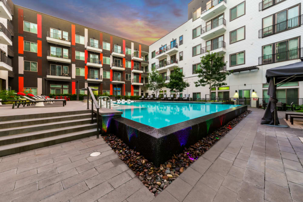 Resort style pool with rocks and stones surrounding base at Marq on Burnet in Austin, Texas