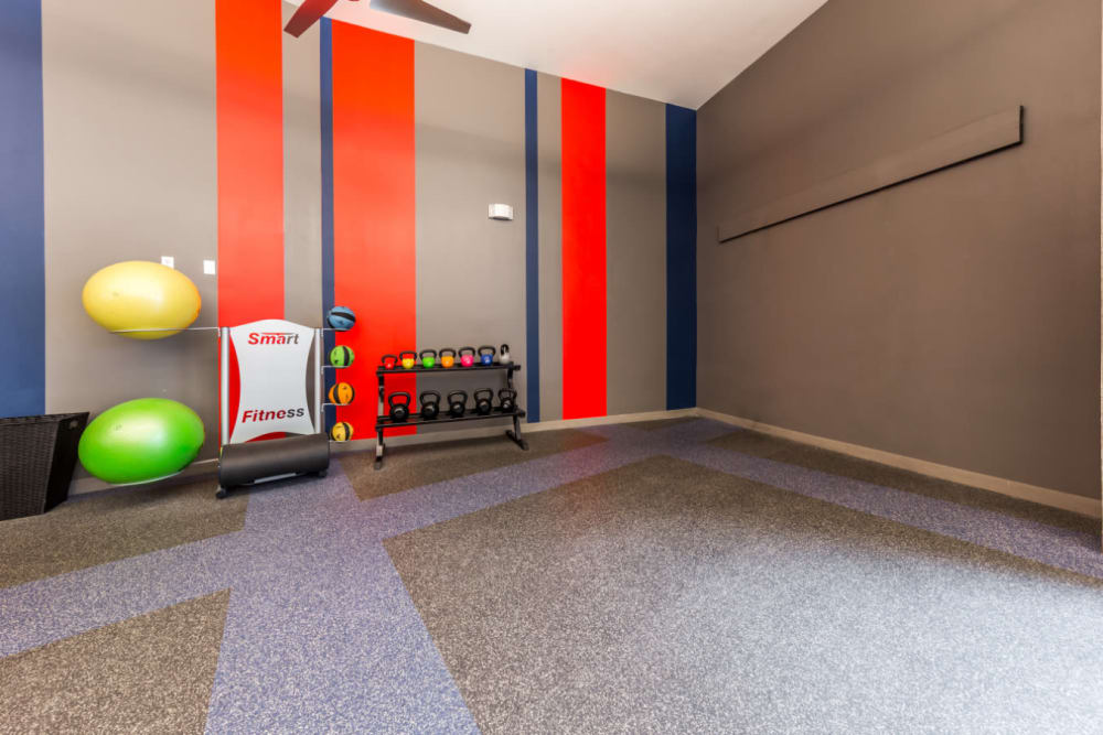 Kettlebell and medicine ball station in yoga room at Marq on Burnet in Austin, Texas