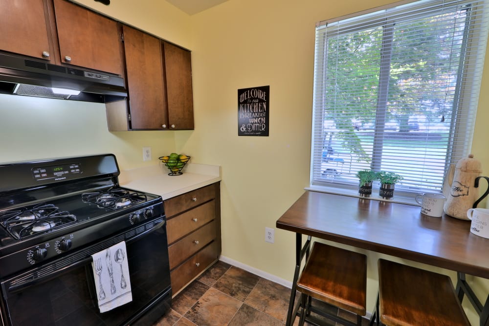 Kitchen with black appliances at Lakewood Hills Apartments & Townhomes in Harrisburg, Pennsylvania